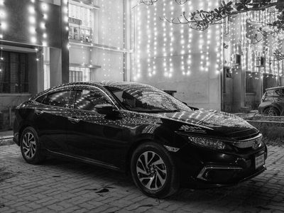 Low light, street and documentary, black and white shot on a Fujifilm X-E5, November 2025.